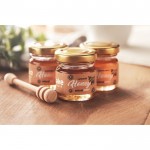 Tarros de miel con dispensador color madera vista bodegón principal