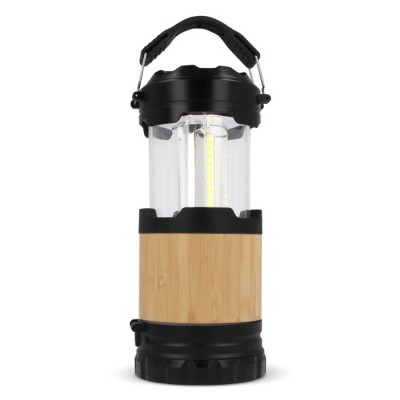 Versátil linterna y lámpara que actúa como farol de ABS y bambú